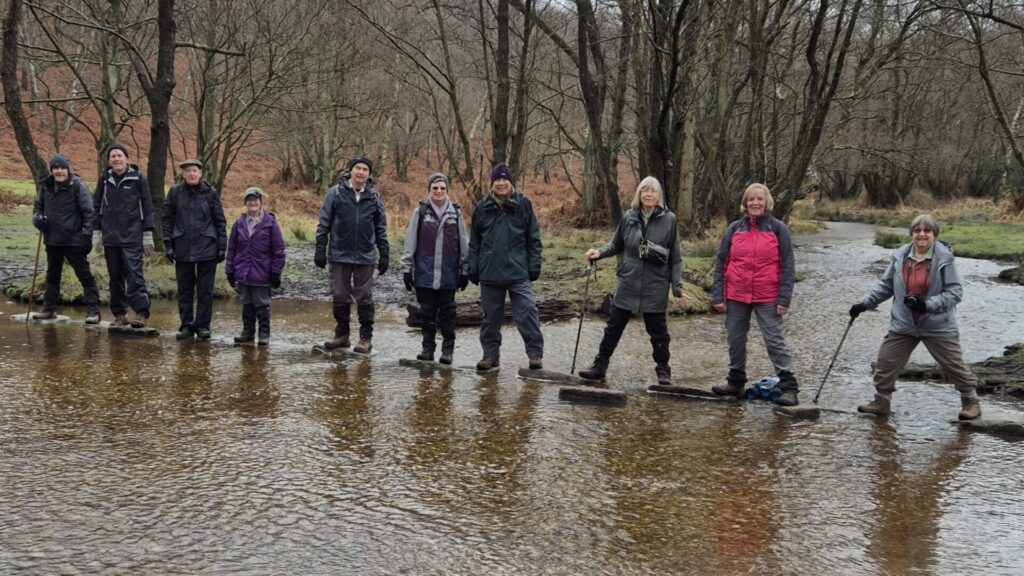 Walking group member on Stepping stones